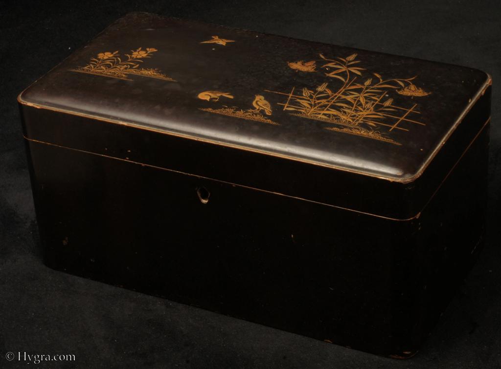  TC565: Japanese Export lacquer tea chest with raised gilded lacquer depicting birds and insects in  watery backgrounds.Inside there are two foil lined canisters their hinged lids decorated with exquisite depictions of insets, again in raisedlacquer. The inside of the chest is in red lacquer sprinkled with gold powder,  <i>nashiji. </i>Circa 1880 Enlarge Picture